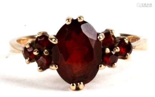 A 9ct gold garnet set ring approx UK size M