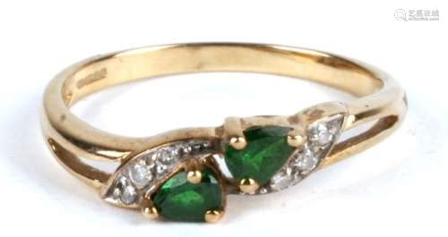 A 9ct gold emerald and diamond ring. Approx UK size N