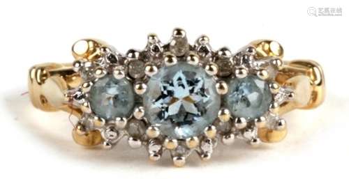 A 9ct gold diamond and topaz ring, Approx UK size L