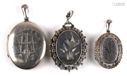 Three Victorian silver lockets. largest. 4cm (1.5 ins) high