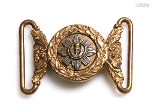 A 19th century Scots Guards silver on brass two part belt buckle. Overall width 6.5cms (2.5ins)