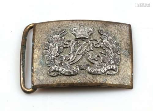 A 19th century Dragoon Guards Officers silver on brass waist belt buckle. Having a seeded gilt plate