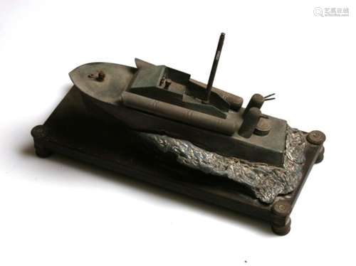 A WW2 trench art style metal model of a Motor Torpedo Boat (MTB) with petrol lighter on the bow