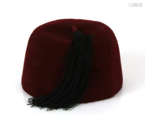 From a private collection, a Waffen SS Handschar Division maroon felt fez. Missing its cloth badges.