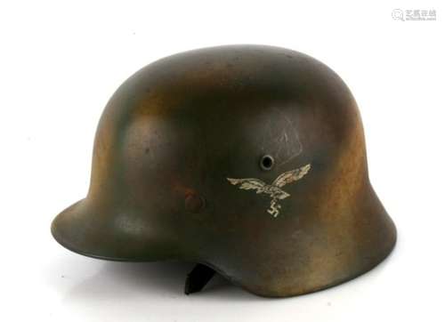 A WW2 Third Reich Luftwaffe combat helmet with Normandy camouflage. Double decals with liner and