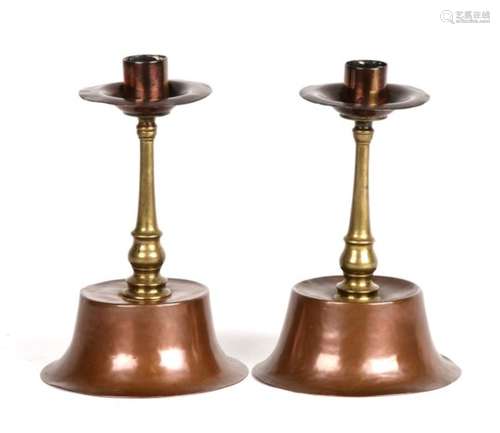 A pair of Arts and Crafts copper and brass candlesticks. 18cm (7ins) high