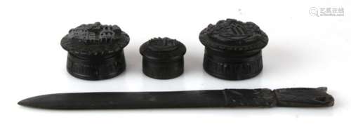 Three Victorian carved Irish bog oak boxes; together with a bog oak letter opener (4).