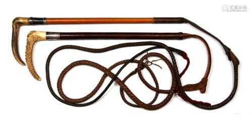 Two silver mounted antler handled riding crop whips. One with stitched leather covered body, the