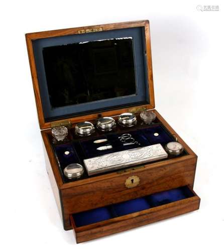 A walnut dressing box with fitted bottles and jars, lift out tray in blue velvet, and spring