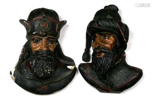 A pair of 18th century continental carved oak heads of bearded men with gesso and painted