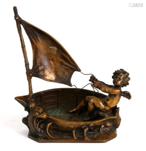 A bronze figure of a cherub in a sailing boat under sail. After Augustus Moreau. 17cm 6.5 inches