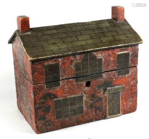 A 19th century perfume caddy in the form of a cottage, interior fitted with a pair of cut glass