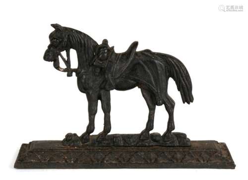 A 19th century black painted cast iron doorstop modelled as a horse in full tack. 17.5cm (7 ins)