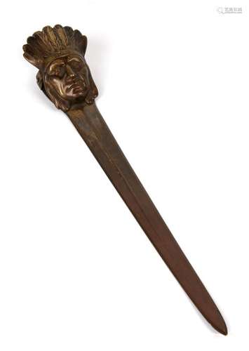 A late 19th century novelty desk clip/ letter opener, with Red Indian chief in full headdress as the