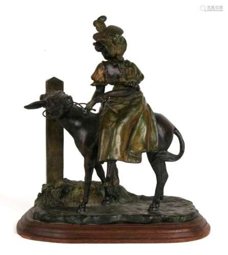 An Ernest Wante bronze group of a lady on a donkey, signed to base with foundry mark, 28cm (11