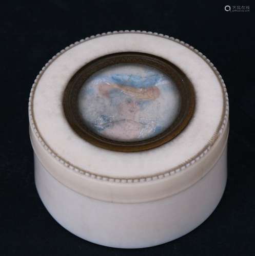 A 19th century ivory powder pot set with a watercolour portrait miniature of a young woman. 5cm (