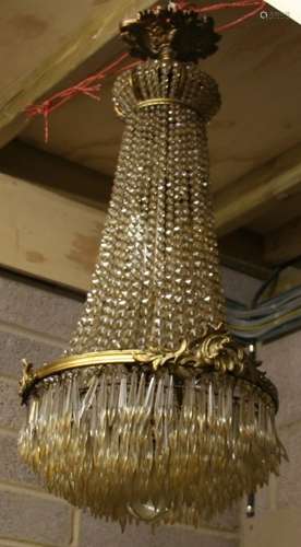 A gilt metal and crystal chandelier. 83cm 32.5ins high.