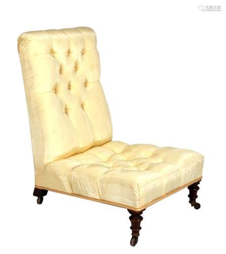 An upholstered nursing chair on turned front supports