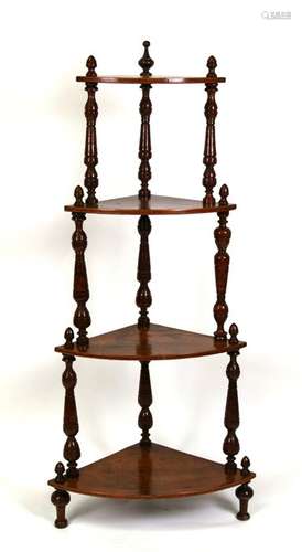 A Victorian walnut four-tier corner whatnot, 62cms (24.5ins) wide.