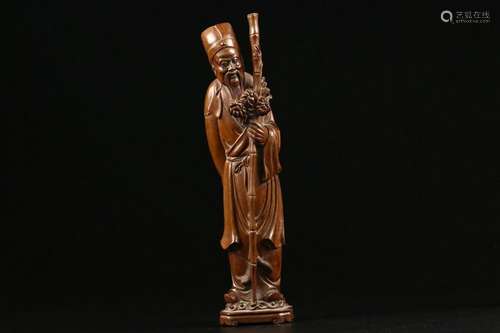 A Carved wooden Statue