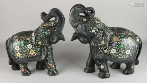 Two heavy black marble stabbed elephants with floral