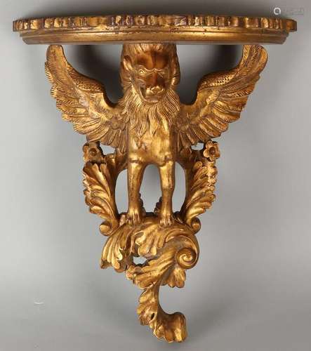 Carved gilt wood wall bracket with winged lion. 20th