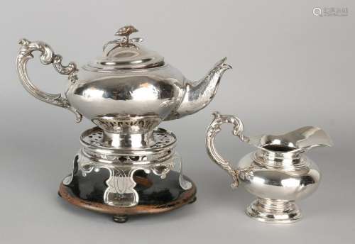 Set with a silver teapot, milk jug in a Comfoor,