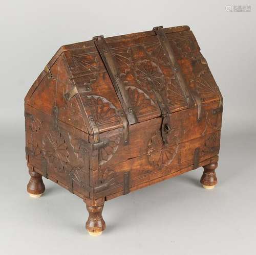 Oriental wood casket stabbed with iron fittings. 20th