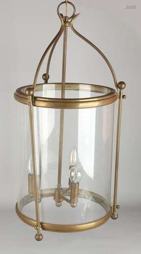 Large three-light brass hall lamp with glass around.