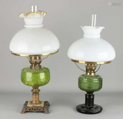 Two antique oil lamps with glass containers. Circa