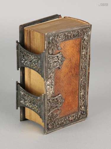 Bible with brown leather cover and silver edges and