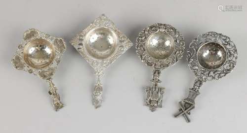 Lot 4 with four silver tea strainers, 835/000, with