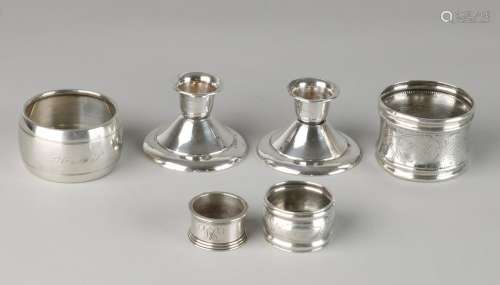 Lot two silver candlesticks and napkin four tires,