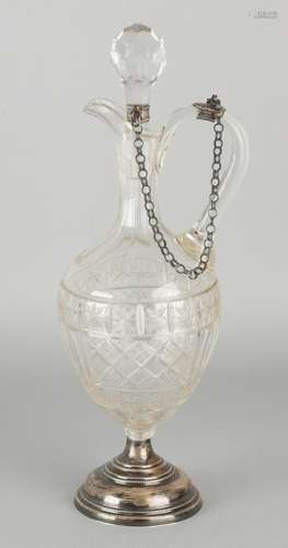 Crystals decanter with handle and pouring spout, placed
