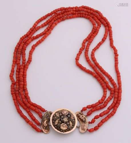 Necklace of coral with yellow gold clasp region,