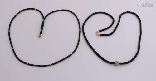 Two necklaces made of rubber and leather with gold