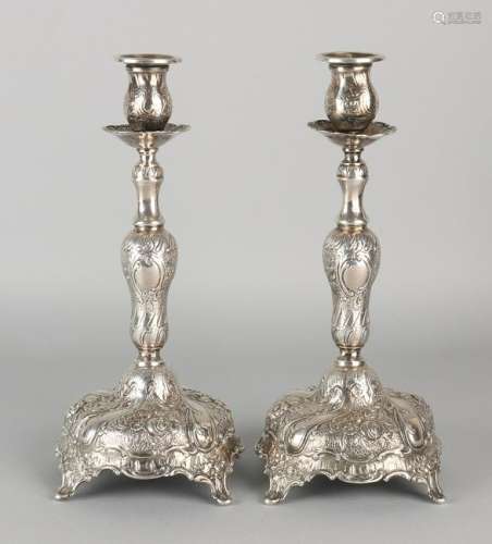 A set of silver candlesticks 800/000, rococo style.