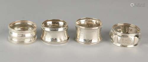 Four silver napkin rings, 835/000, a roll and