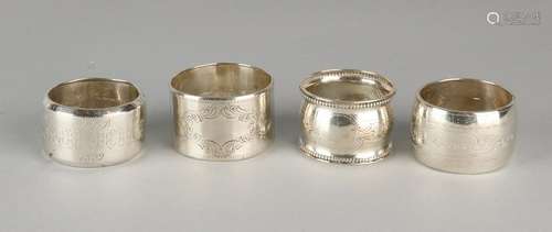 Four silver napkin bands, various levels, round models