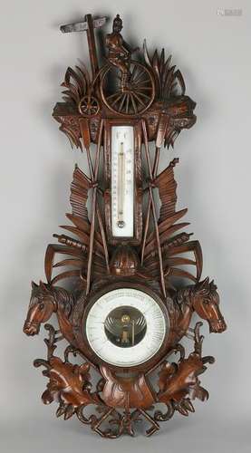 Large antique walnut barometer crossed by bicycle,