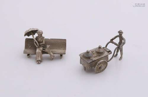 Two silver miniatures, 835/000, woman on a bench with