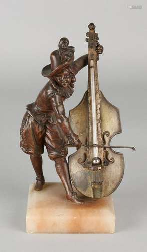 Antique desk thermometer. Circa 1900. Man with cello on