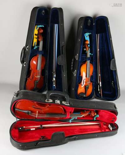 Three violins in old suitcase. 20th century. Size: