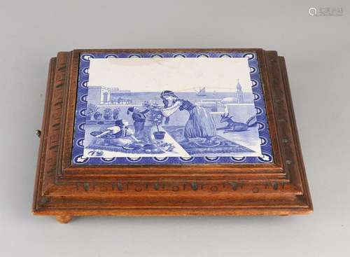 Functioning antique music box with tile. Oriental show.