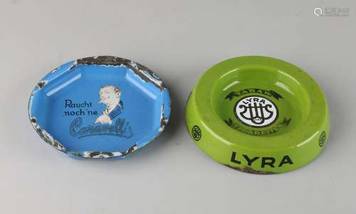 Two enamelled ashtrays with advertising. 20th century.