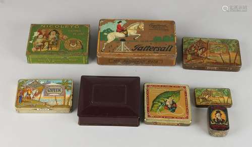 Eight different cans with advertising. 20th century.