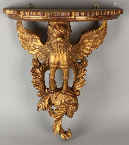 Carved gilt wood wall bracket with winged lion. 20th