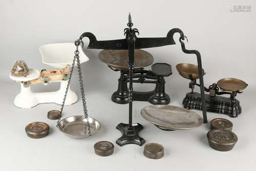 Four antique iron scales with weight sets. England.