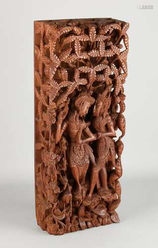 Indonesian wood panel crossed with Javanese dancers.