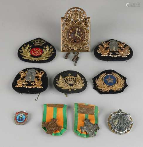 Nine Dutch emblems, including: Marine, port service,